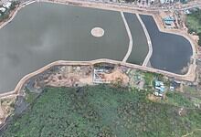 Uppal Nalla Cheruvu lake restored and filled with water during monsoon season in Hyderabad.