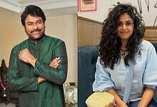 Chiranjeevi and Faria Abdullah seated indoors, smiling at the camera.