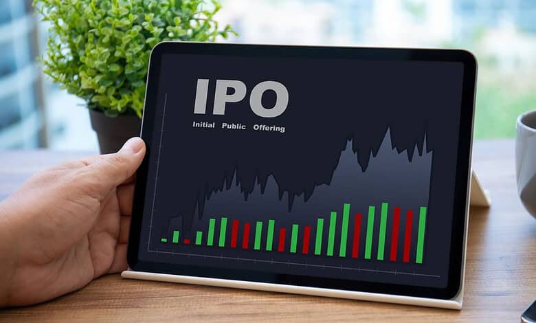 Digital tablet displaying IPO market graph with green and red bars and line chart.
