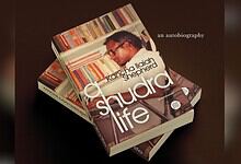 Book cover of 'Shudra Life' by Kancha Ilaiah Shepherd with a man reading.