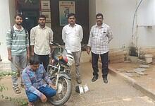 Police officers with a suspect and seized ganja in Hyderabad, India.