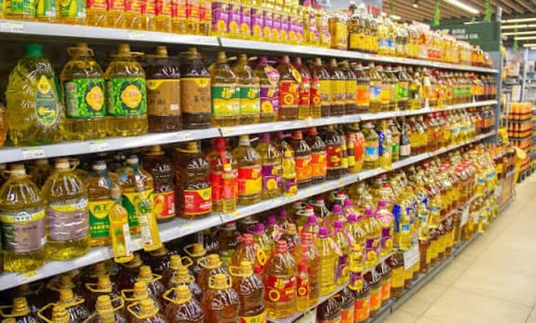 Variety of edible oils on supermarket shelves in India.