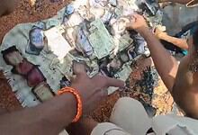 Rescue operation involving a person and a large pile of cash and gold in Vikarabad fire.