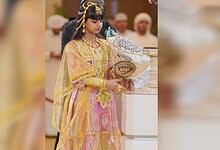 Shaikha Al Mansoori holds a rare white falcon at ADIHEX 2026 in Abu Dhabi.
