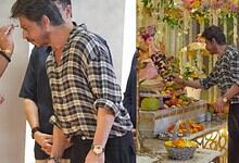 Shah Rukh Khan at a religious ceremony wearing a checkered shirt and a gold watch.