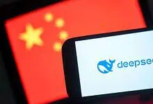 DeepSeek logo displayed on a mobile phone with the Chinese flag in the background.