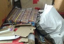 Seized firecrackers and packaging materials in a storage area before Diwali.