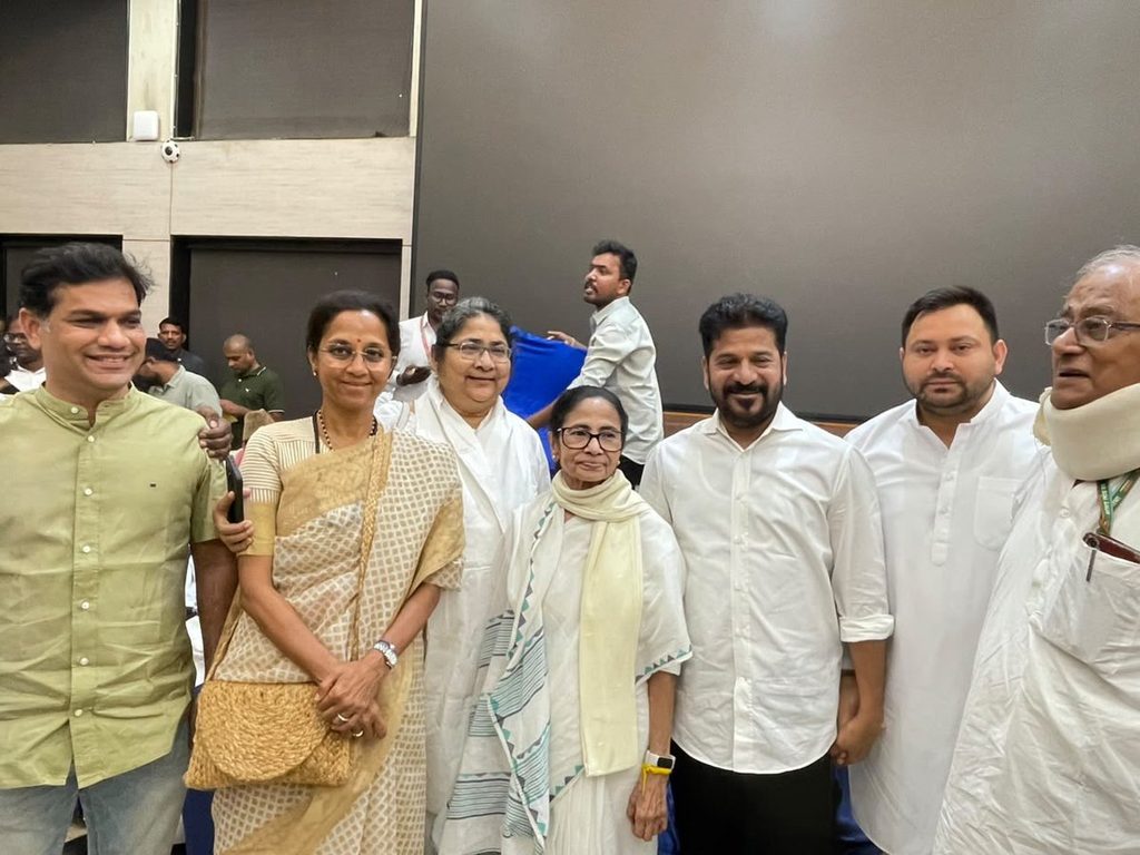 Group of protest leaders and officials at a public event in Delhi.
