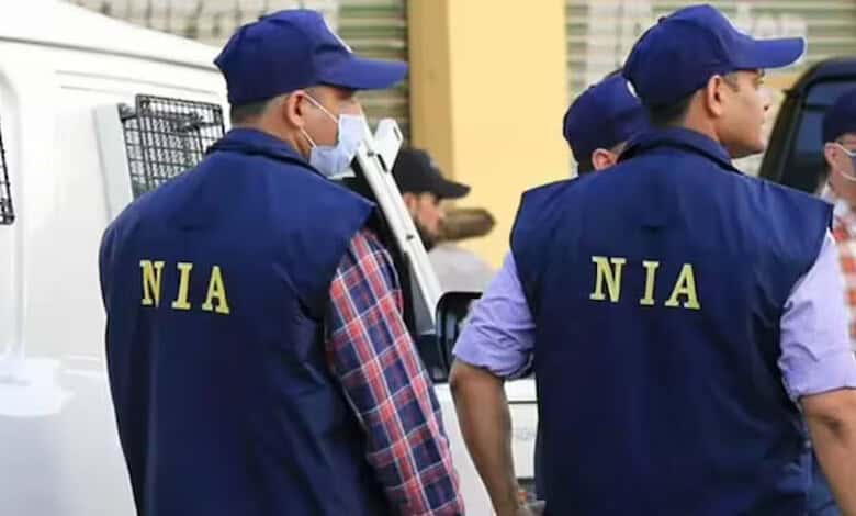 NIA officials in Srinagar during property attachment operation linked to Pakistani LeT terrorists.