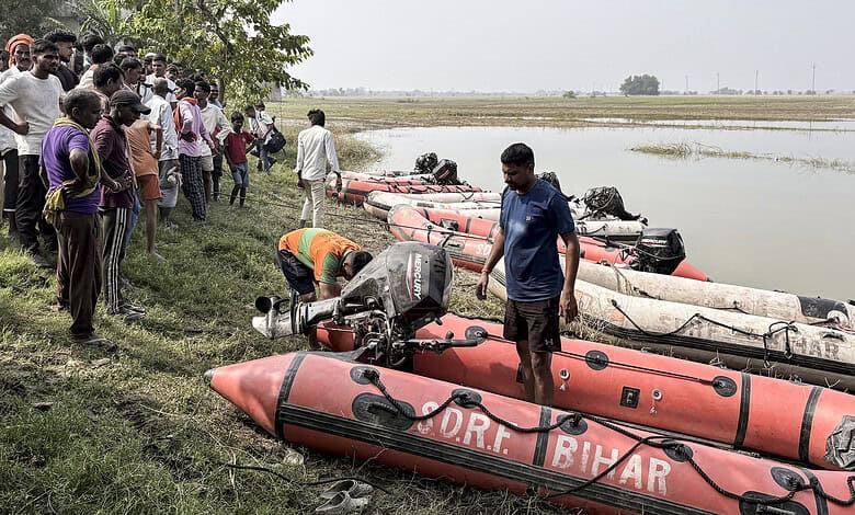 Rescue operation with boats on a riverbank in Bihar amid ongoing search efforts.