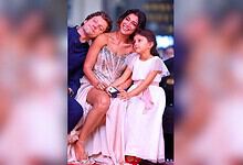 Shriya Saran with her family, smiling and enjoying a moment together.