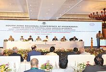 South Zone Regional Conference on legal services in Hyderabad with speakers and audience.