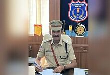 Telangana police officer in uniform at Rachakonda Police station office.