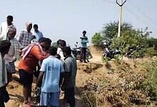 Group of farmers and villagers gathered near a water source in Telangana's Wanaparthy.