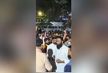 Crowd gathered at Dandiya event in Hyderabad's Begumpet, with some people raising hands and engaging in a.