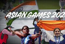 Indian athletes celebrate with flags at Asian Games 2026 event.