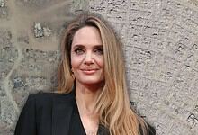 Angelina Jolie pictured against a satellite image showing Gaza’s destruction.