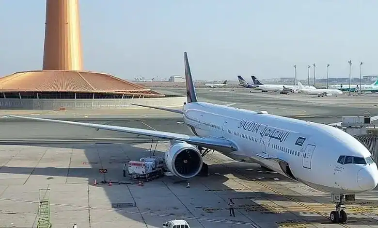 Passenger airplane parked at Riyadh airport during extended closure amid security concerns.