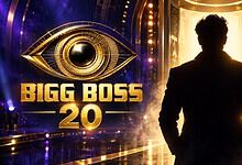 Silhouette of a man in a suit standing in front of a bright, golden stage with Bigg Boss 20 logo.